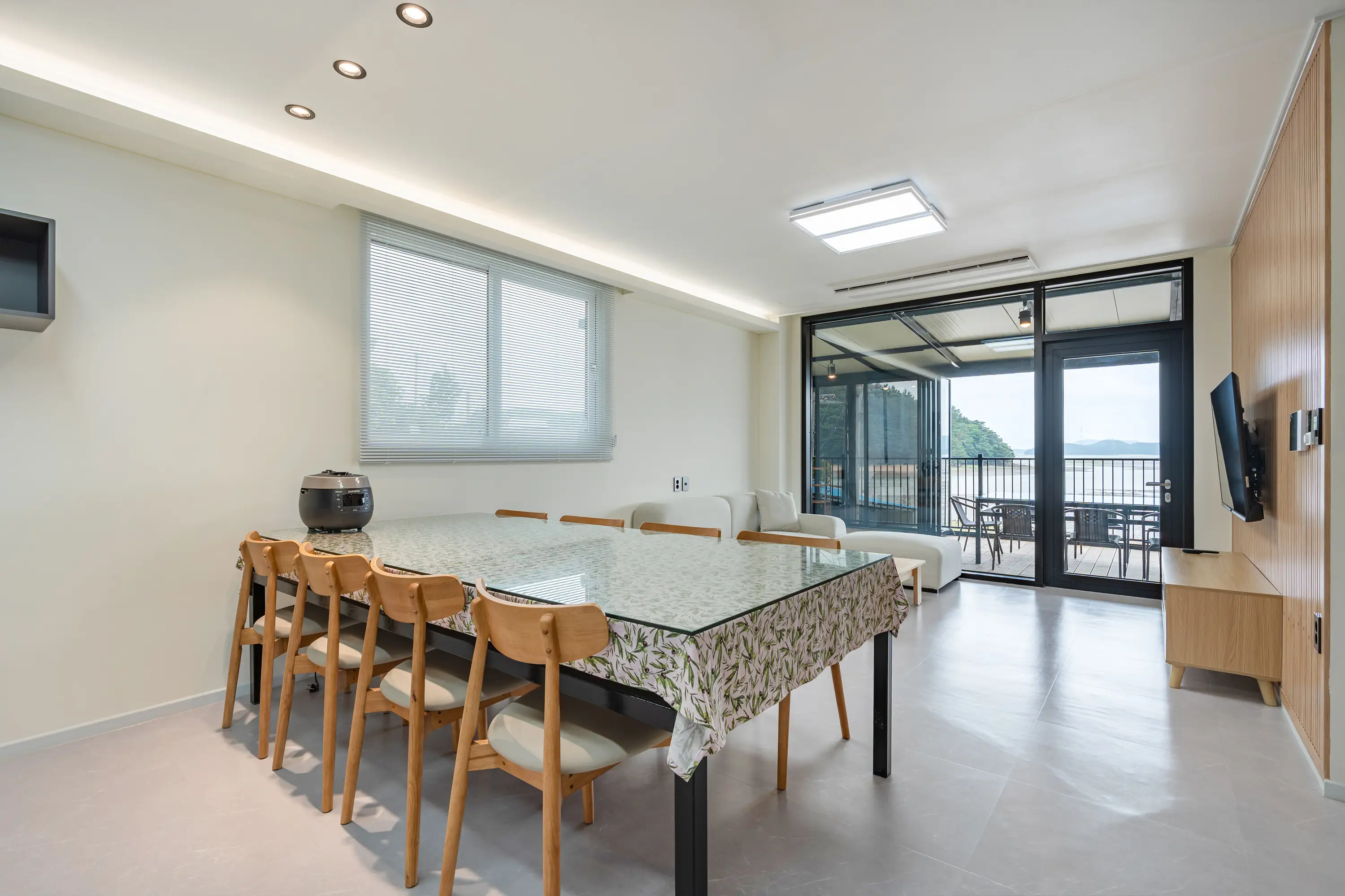 First-floor living room with natural light through wide windows